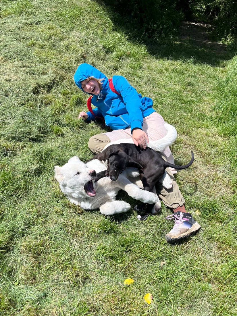 Milena outdoors with two dogs
